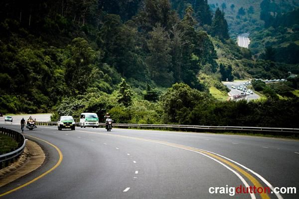 Jay Thomson (360 Life) in the breakaway with the peloton in the distance.