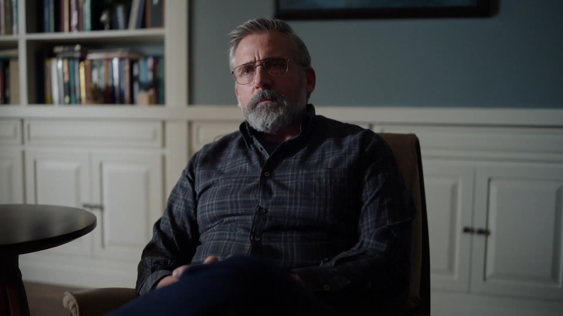 Steve Carell's Alan Strauss sits in a chair in The Patient