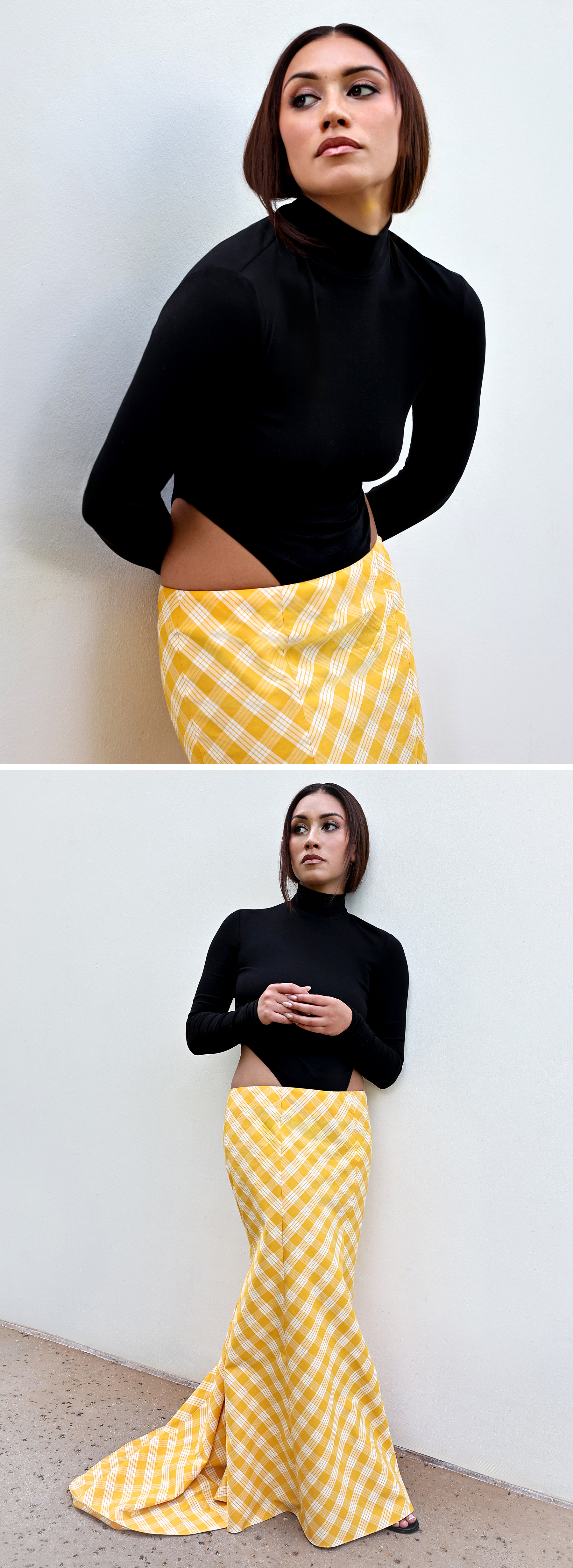 Luciane Buchanan photo taken during a press day for her new show Chief of War. She is wearing a custom look by Hawaiian designer Rocket Ahuna consisting of a black high neck, long-sleeve top that cuts up on the side and a yellow and white gingham maxi skirt.