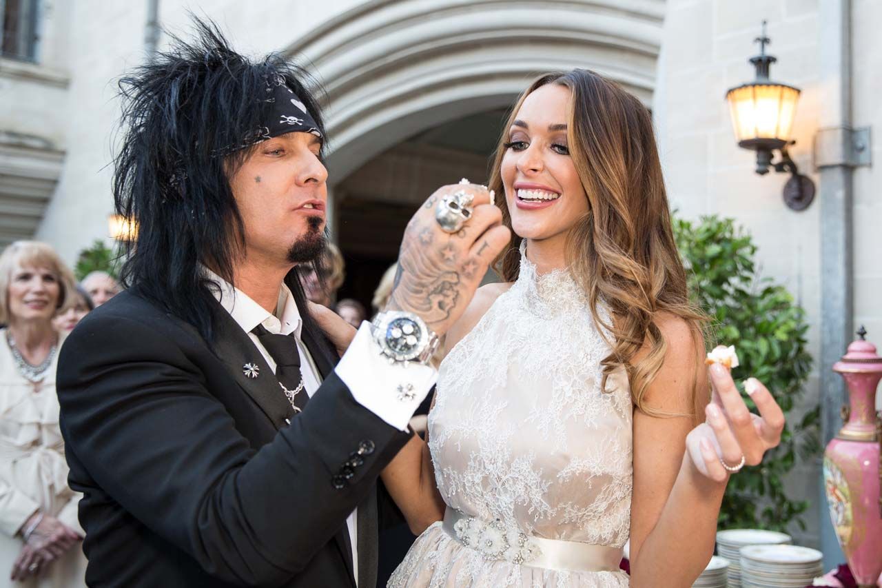 Nikki and Courtney Sixx cut the cake at their wedding at Greystone Mansion in Beverly Hills, California.