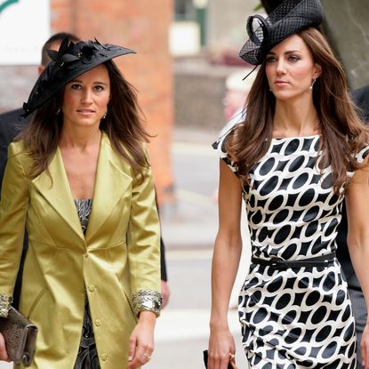 James Middleton wears a velvet suit and has a beard, Pippa Middleton wears a gold coat and Kate Middleton wears a white and black dress