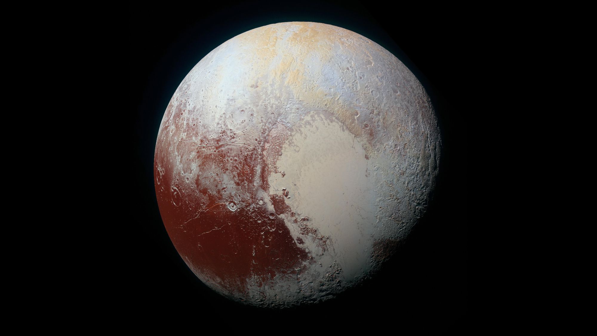 A view of a world with tan shades and a reddish area toward the bottom left of it.