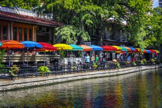 This historic urban waterway is called the San Antonio Riverwalk. Located in downtown San Antonio, Texas, it has hotels, restaurants, and shops that attracts millions of visitors.