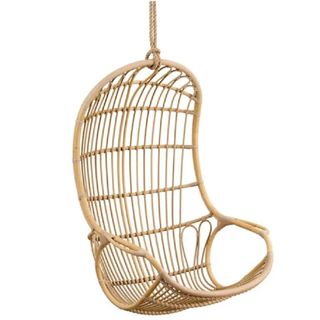 An outdoor swinging chair with a natural finish