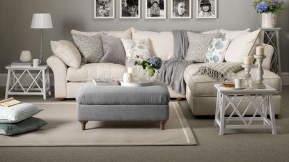 blue and white bedroom with pale blue patterned carpet and white and blue bedlinen