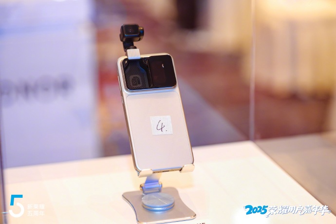 A snapshot of the Honor Robot Phone in white, which has its gimbal camera flipped upward.