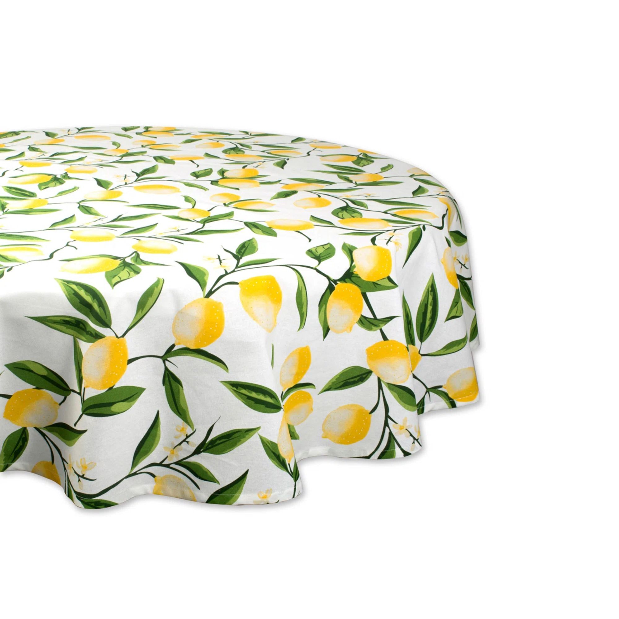 A white round tablecloth with a lemon pattern with green leaves