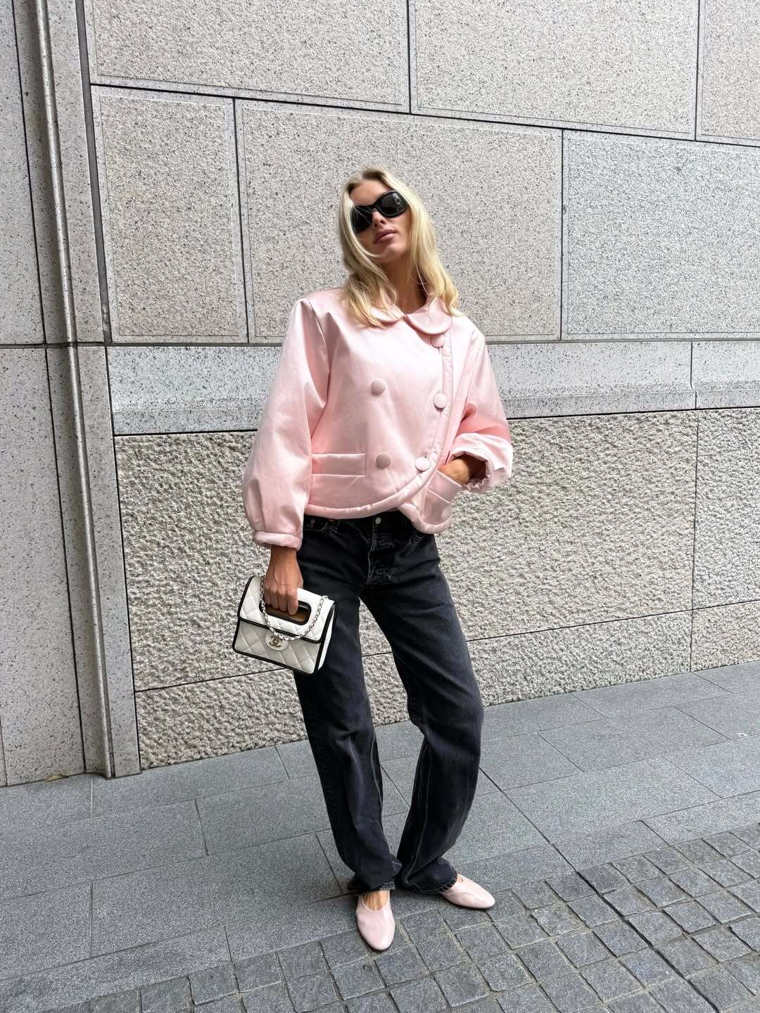 Elsa Hosk wore the peony pink color trend on her jacket and high-vamp flats