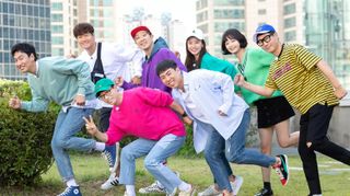 a group of people (lee kwang-soo, kim jong-kook, yoo jae-suk, haha, yang se-chan, song ji-hyo, jeon so-min, and lee seok-jin), pose in a running stance, in promo still for 'running man'