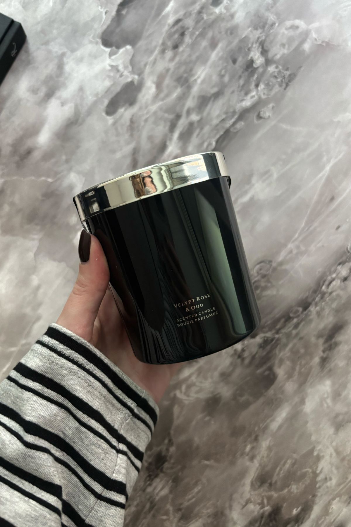 Deputy beauty editor Grace Lindsay holding the Jo Malone London Velvet Rose &amp;amp; Oud candle