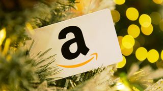 A white Amazon gift card shown on Christmas tree