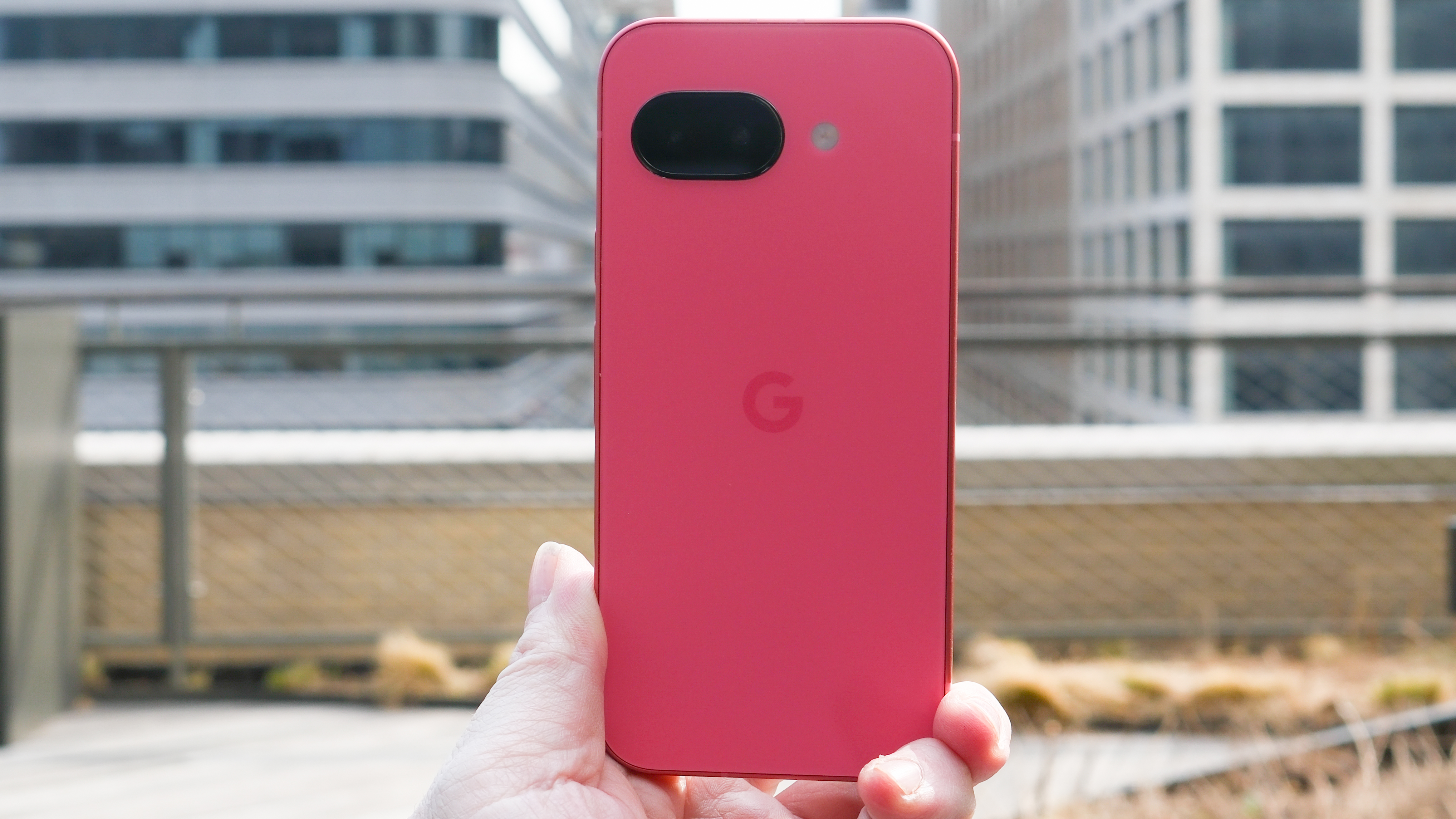 Google Pixel 9a in black, peony pink, iris, and porcelain, showing back cover with camera and home screen