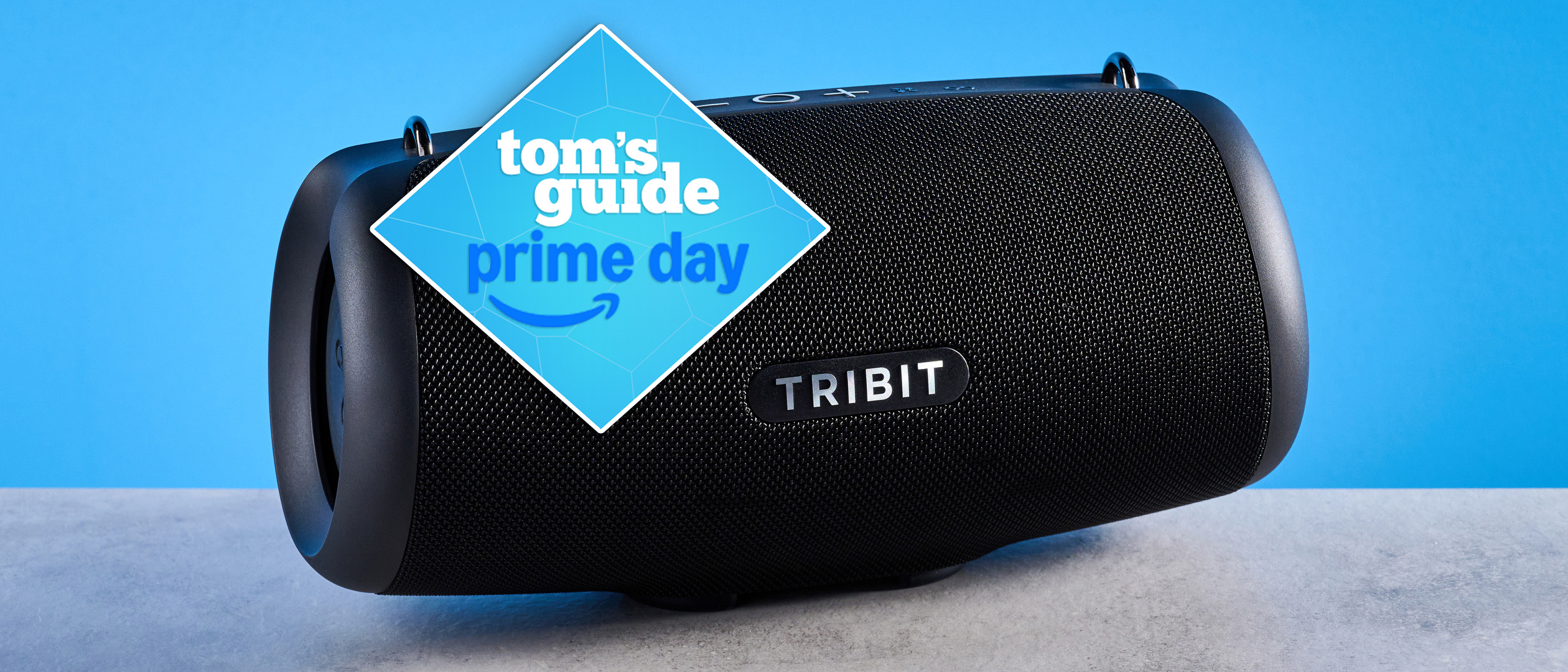 Tribit StormBox Lava Bluetooth Speaker photographed in front of a blue background.