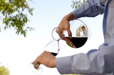 Pouring wine from a decanter into a glass