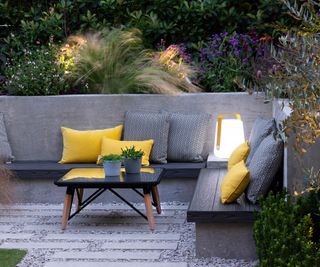 Built in seating in a back garden with outdoor cushions