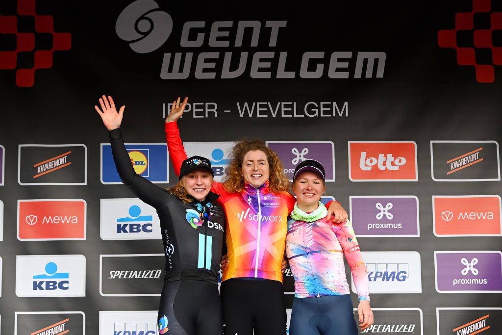 WEVELGEM BELGIUM MARCH 26 LR Megan Jastrab of The United States and Team DSM on second place race winner Marlen Reusser of Switzerland and Team SD Worx and Maike Van Der Duin of The Netherlands and Team CanyonSRAM Racing on third place pose on the podium ceremony after the 12th GentWevelgem In Flanders Fields 2023 Womens Elite a 1625km one day race from Ypres to Wevelgem UCIWWT on March 26 2023 in Wevelgem Belgium Photo by Luc ClaessenGetty Images