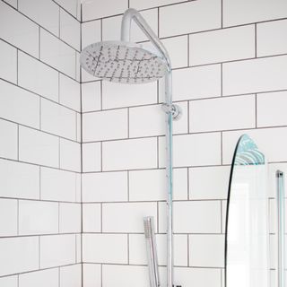 contemporary showerhead in tiled shower area