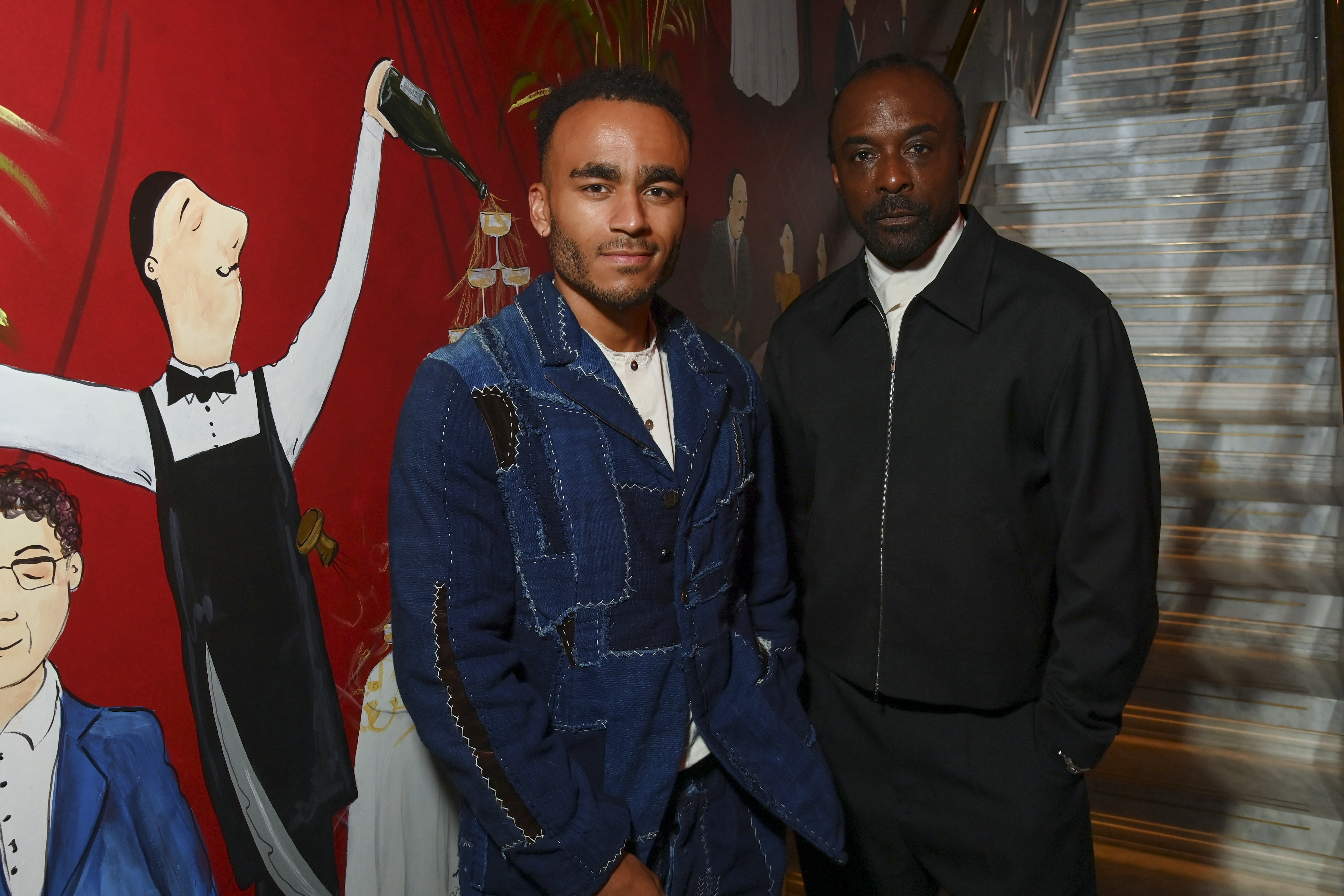 Munya Chawawa and Ariyon Bakare attend the UTA and British Vogue party at Carbone to celebrate London Film Festival and Frieze on October 14, 2025 in London, England.