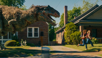 Two kids running from a huge dinosaur
