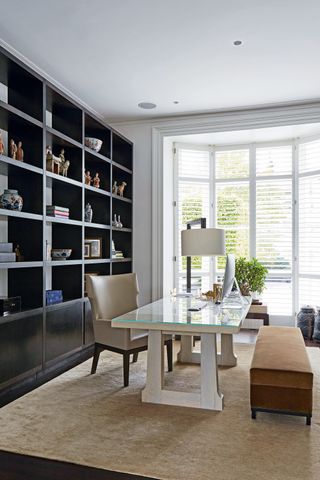 A home office with full height shutters
