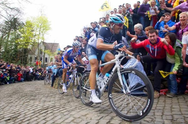 Tour of Flanders: Fabian Cancellara and Sylvain Chavanel are about to be caught on the slopes of the Muur, as Philippe Gilbert charges around the corner behind.