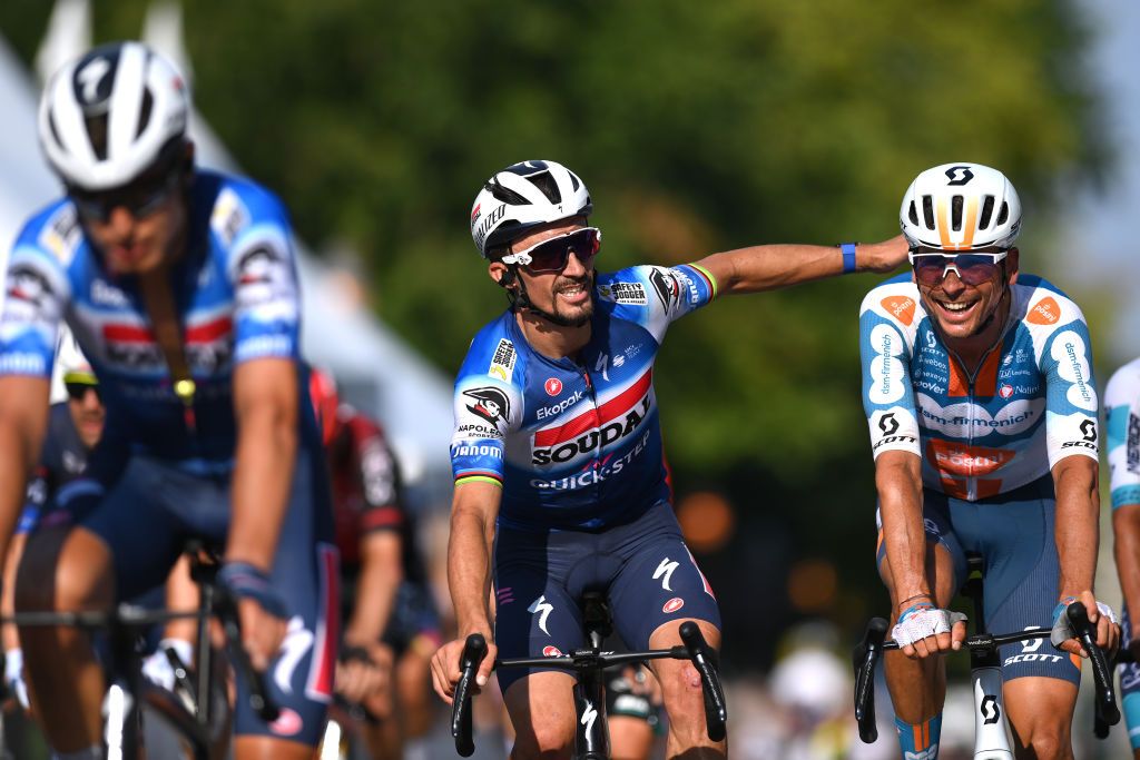QUEBEC CITY QUEBEC SEPTEMBER 13 LR Julian Alaphilippe of France and Team Soudal QuickStep and Warren Barguil of France and Team dsmfirmenich PostNL react crossing the finish line during the 13th Grand Prix Cycliste de Quebec 2024 a 2016km one day race from Quebec City to Quebec City UCIWT on September 13 2024 in Quebec City Quebec Photo by Alex BroadwayGetty Images