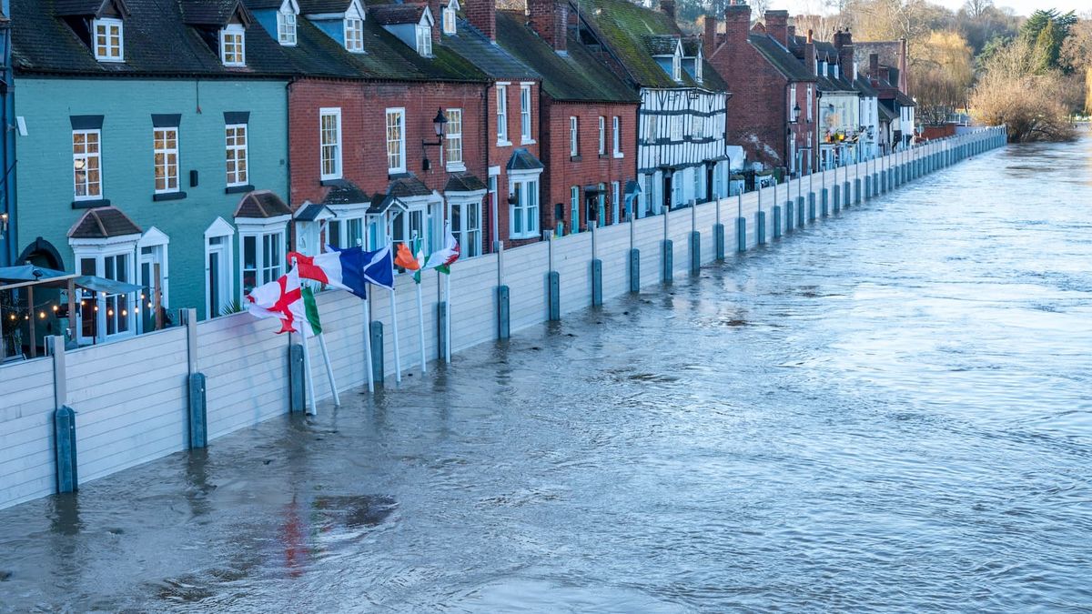 National flags and flood barriers erected to protect local population in Bewdley Bridge, Worcestershire, England