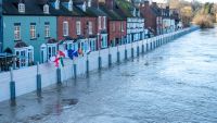 National flags and flood barriers erected to protect local population in Bewdley Bridge, Worcestershire, England