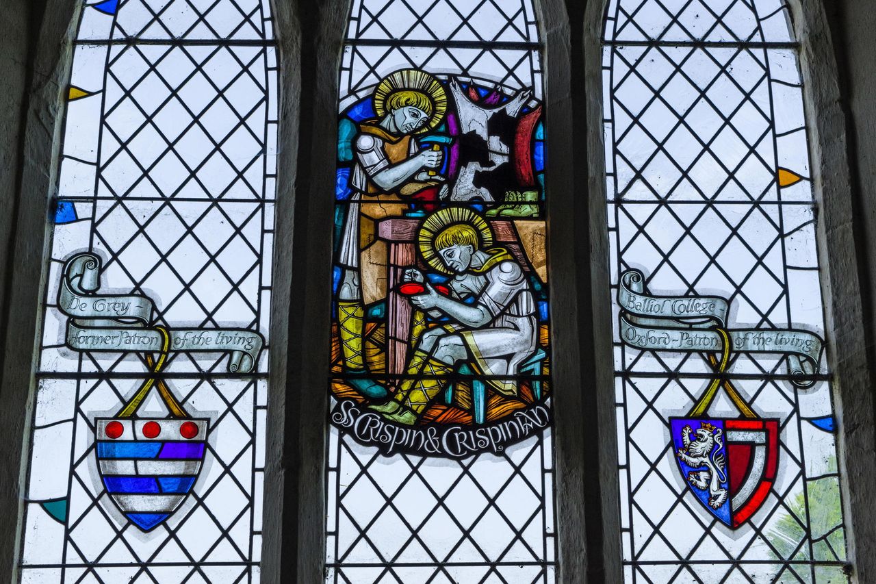 St Crispin and St Crispian celebrated in stained glass at St Peter&#039;s church, Harrold, Bedfordshire.