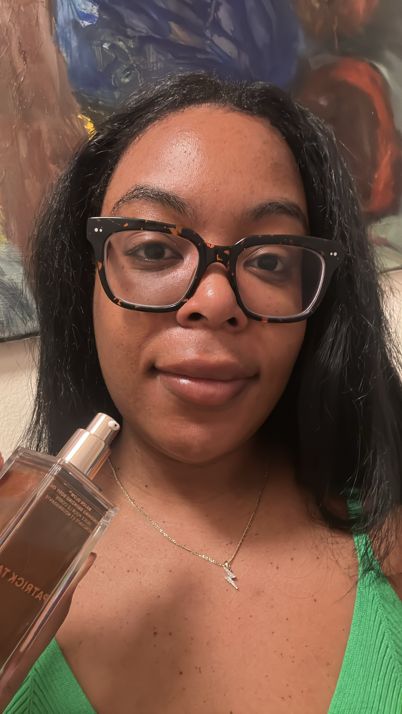 Ariel Baker testing the Patrick Ta Major Glow Nourishing Bronzing Body Oil.