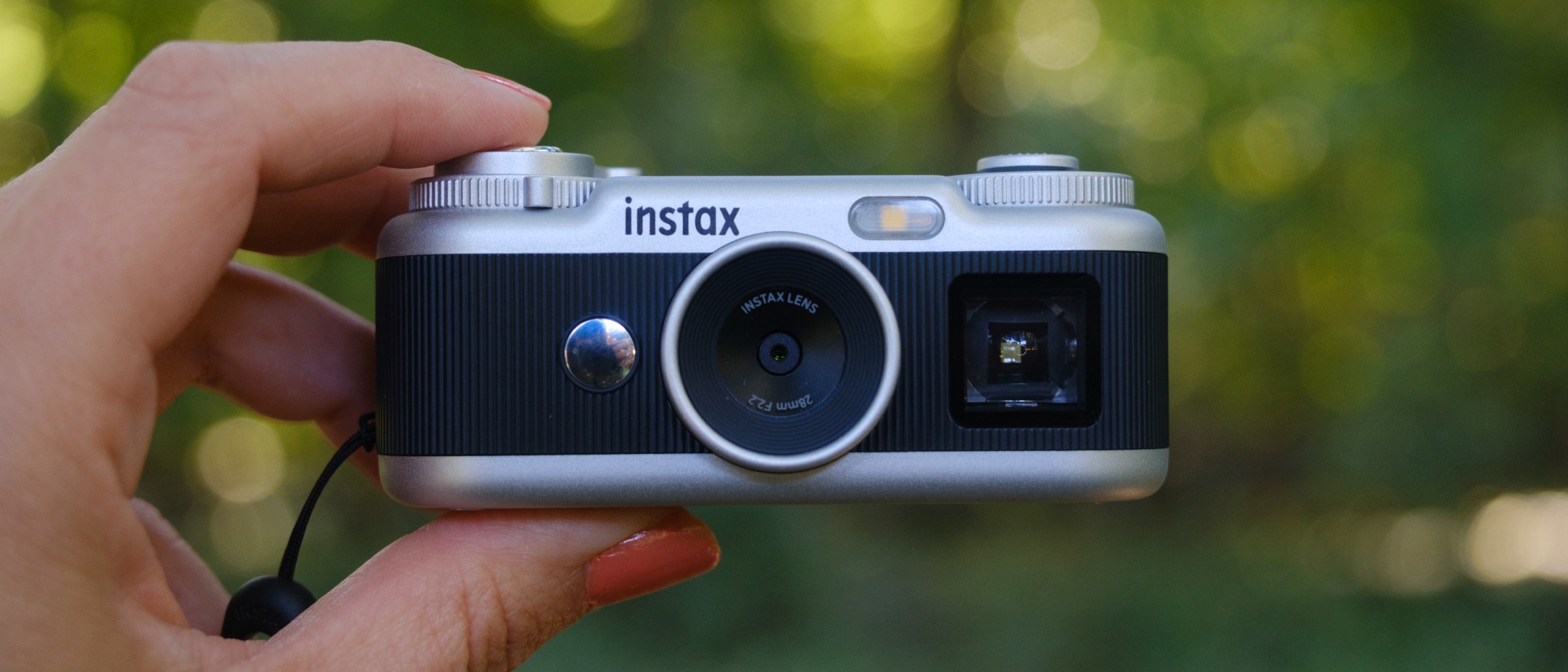 The Instax Pal 2 held in a photographer's hands