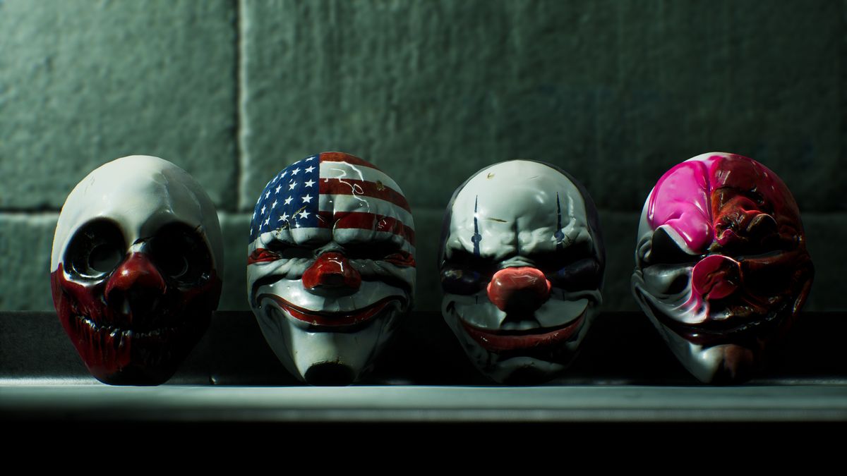 Four masks lined up on a shelf