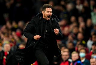 Atletico Madrid boss Diego Simeone runs off in celebration after beating Manchester United