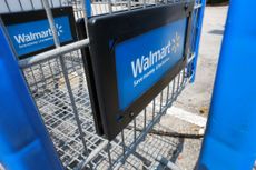 closeup of Walmart sign on shopping cart in parking lot