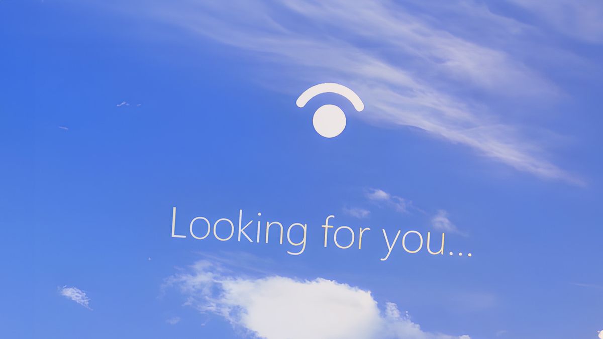 Windows Hello login screen with &#039;looking for you&#039; text