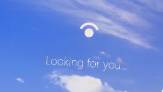 Windows Hello login screen with 'looking for you' text