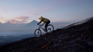 Richard Gasperotti riding down a volcano in Guatemala