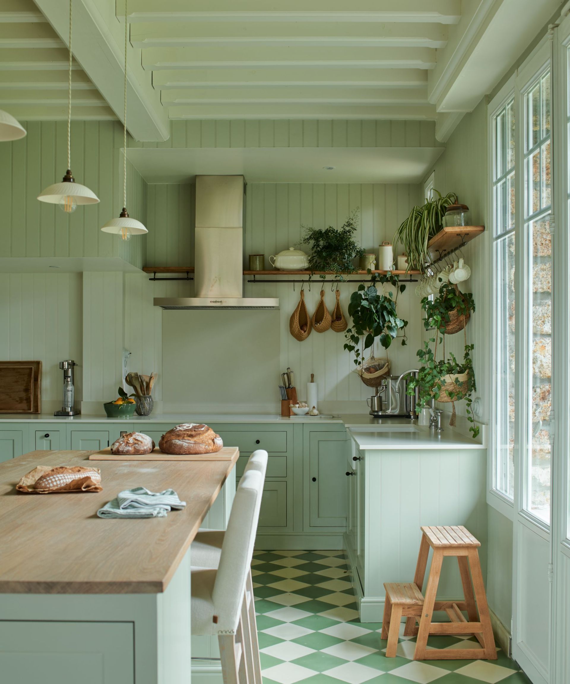 cozy rustic kitchen color-drenched mint green with green tiled flooring
