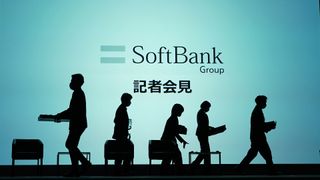 Workers on the stage as they prepare for a SoftBank Group Corp. news conference in Tokyo, Japan