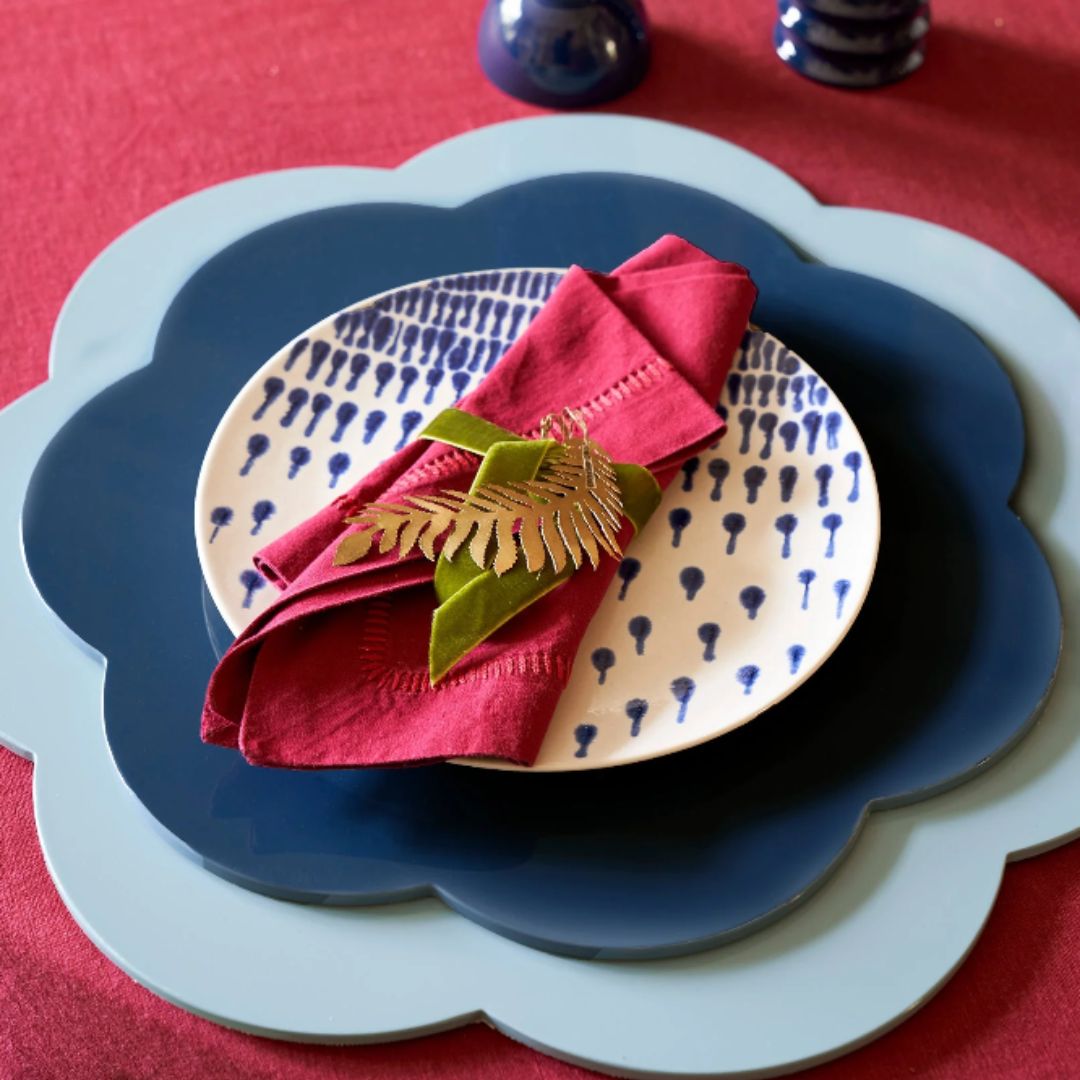 table decor flower-shaped placemats layered with dinner plate and napkin