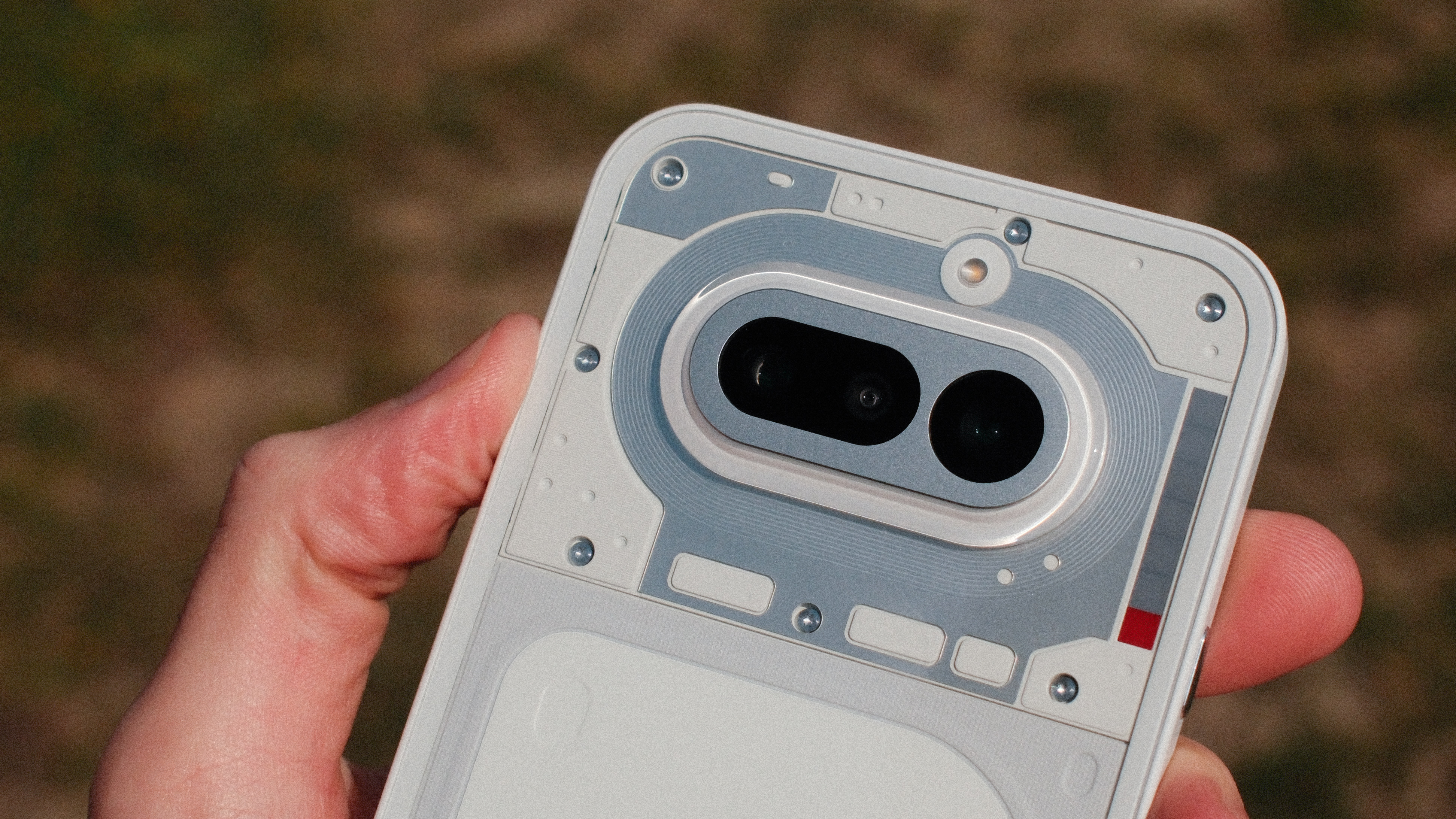 Close-up of the Nothing Phone (4a) rear camera module and surrounding industrial-style design elements.
