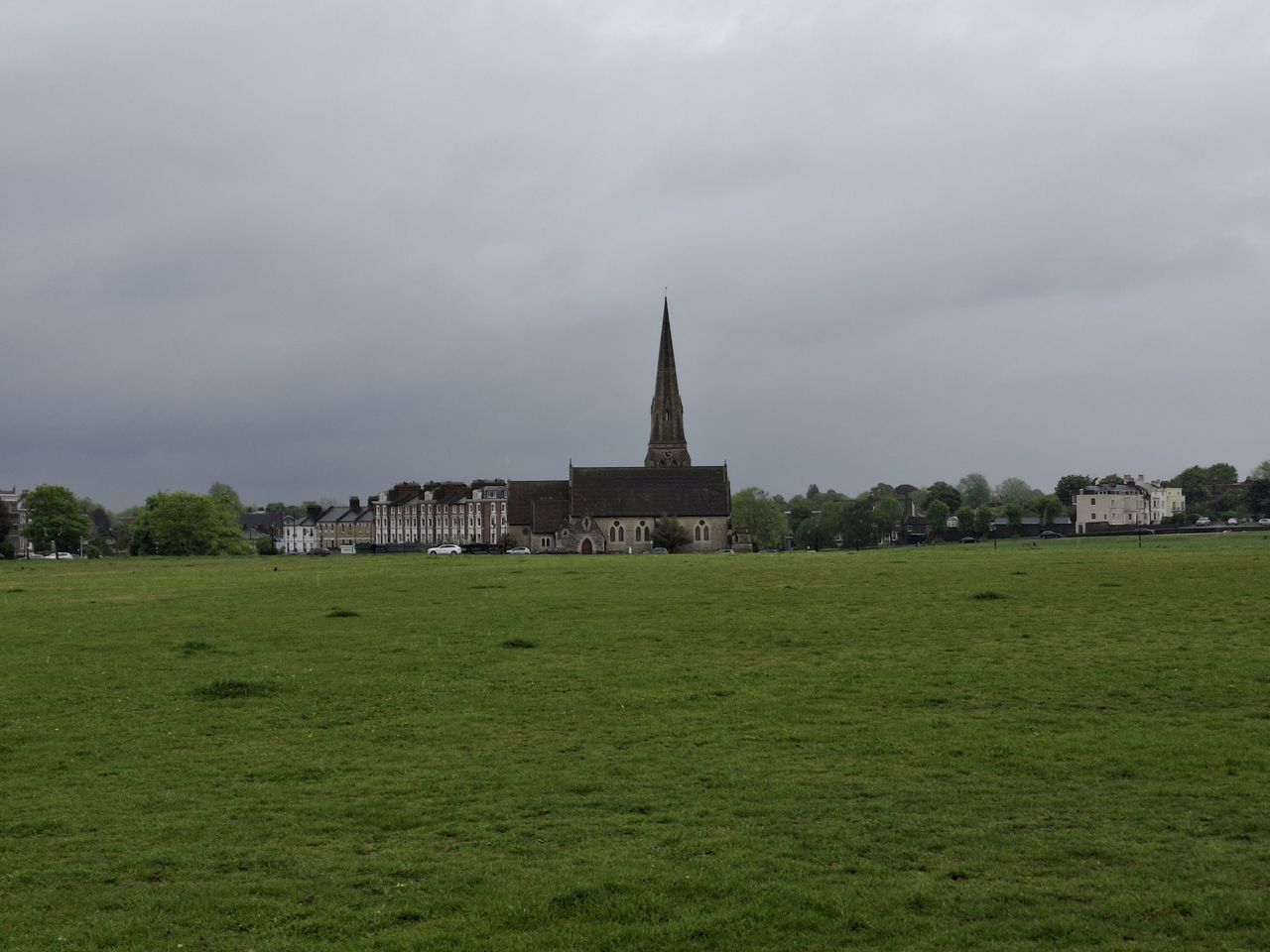 A field with a church taken on the Samsung Galaxy A35