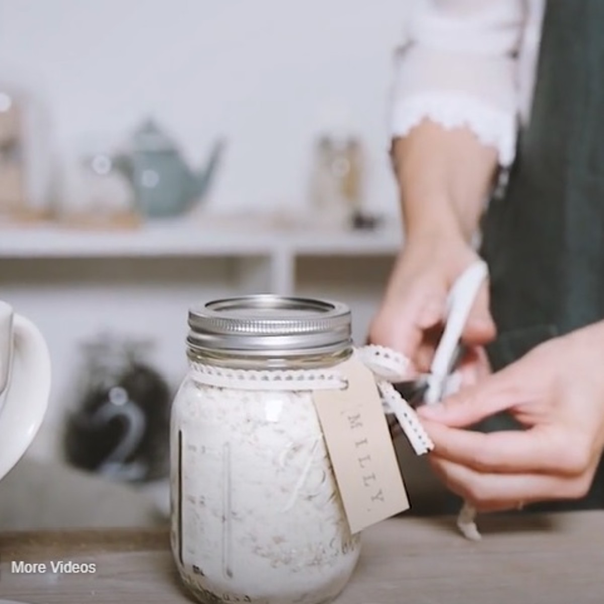 oaty bath milk in glass jar with stamped label