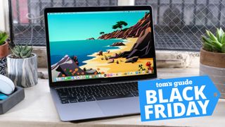 MacBook Air M1 on window ledge with Black Friday deal logo