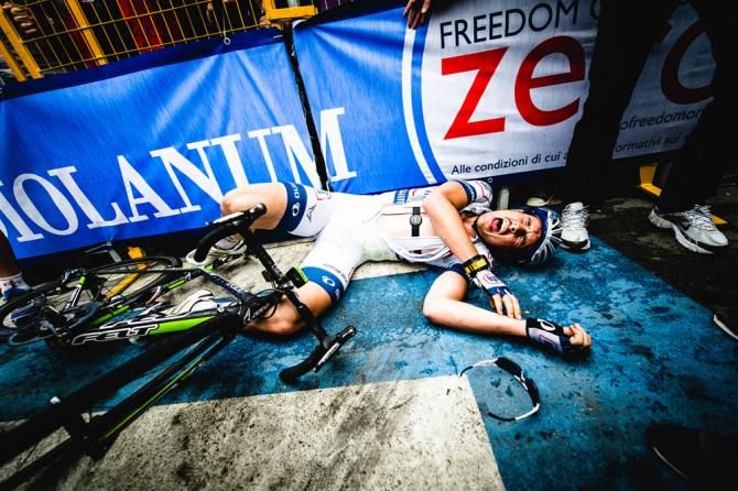 John Degenkolb collapses to the ground following a brilliant final kilometer effort, which netted him the victory in the fifth stage of the Giro d'Italia in Matera.