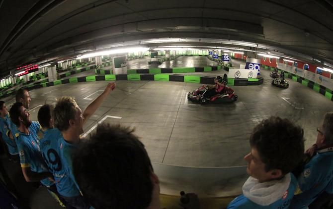 The riders cheer on their teammates on the track