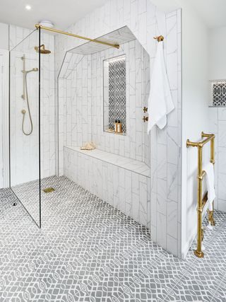 Shower storage ideas in-built bench marble bathroom by Ripples