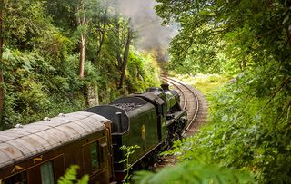 A steam locomotive 44806 (Magpie/Kenneth Aldcroft) on the North Yorkshire Moors Railway travelling through Beck Hole.