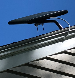 Although the antenna was initially installed on the author's roof, it was eventually moved to the attic.
