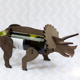 wooden dinosaur with wine rack and wine bottle